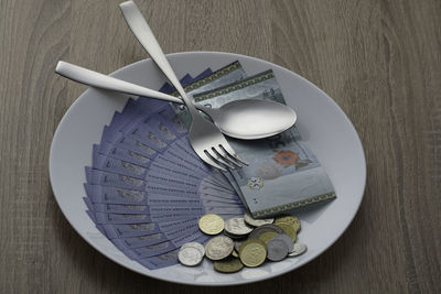 High angle view of eggs in plate on table