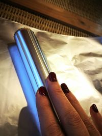 Close-up of hand on table