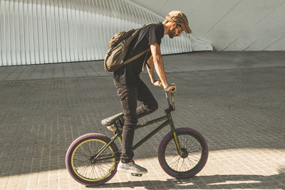 Man riding bicycle in city