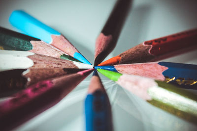 Close-up of multi colored pencils on table