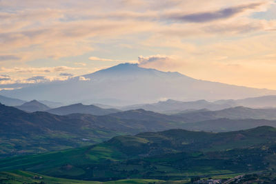 Scenic view of mountains against sky during sunset