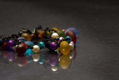 Close-up of multi colored pencils on glass table