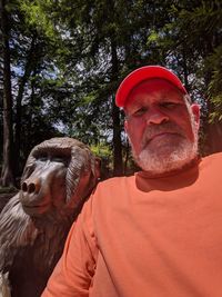 Portrait of man wearing mask against trees