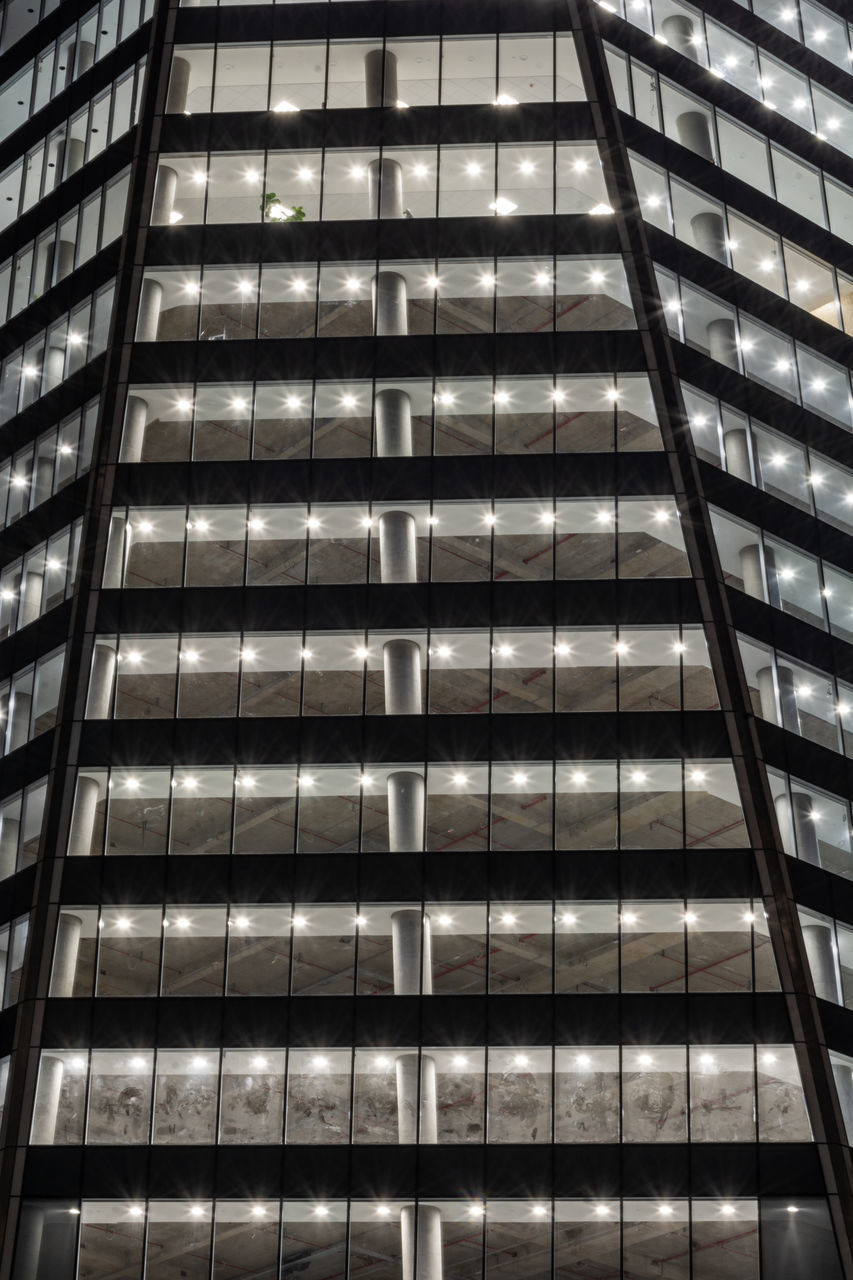 LOW ANGLE VIEW OF GLASS BUILDING