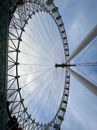 Low angle view of london eye  against sky