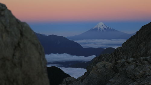 Scenic view of mountains against sky during sunset