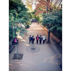 People walking on road in city