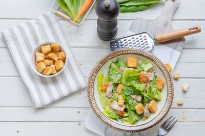 Salad in plate on table