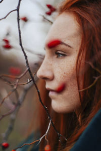 Close-up of thoughtful teenage girl looking away at park