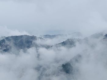 Scenic view of snow covered mountains against sky