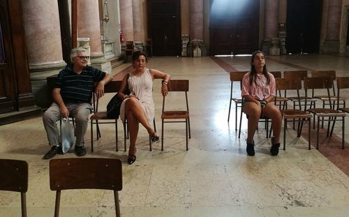 Group of people sitting on chair