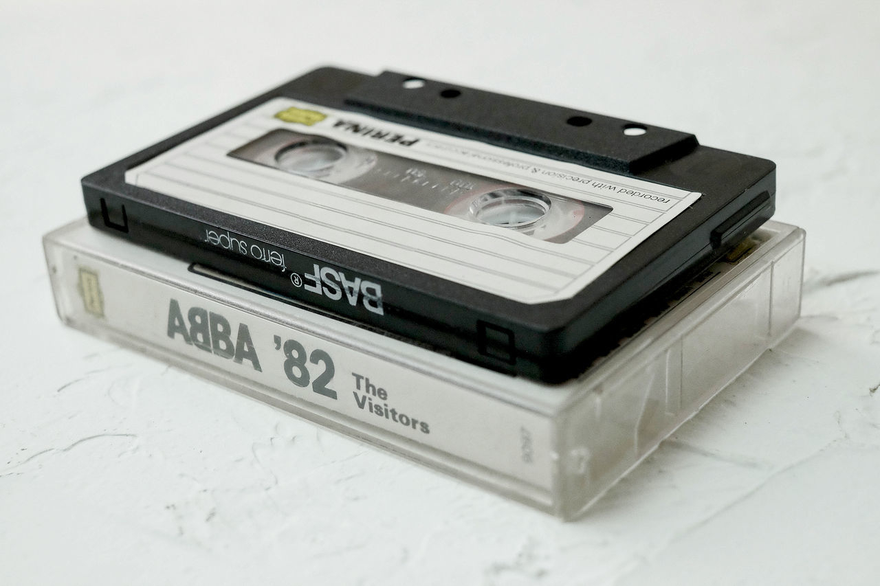 compact cassette, technology, retro styled, indoors, studio shot, no people, white background