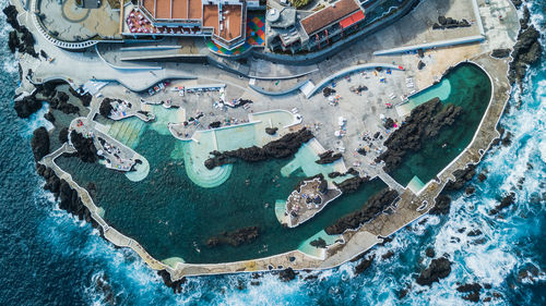 Aerial view of buildings by sea