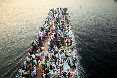 High angle view of people enjoying in sea