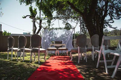 Empty chairs and tables in park