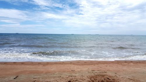 Scenic view of beach against sky