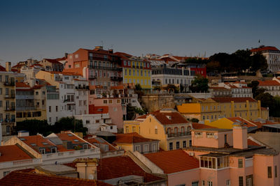 High angle view of buildings in city against clear sky
