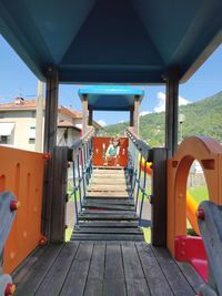 Empty seats in row against sky