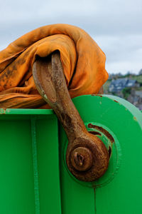 Close-up of rope tied up on wood