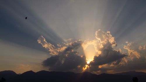 Low angle view of silhouette mountain against sky during sunset