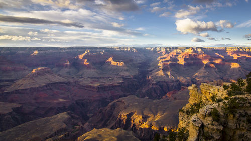 Scenic view of mountains against cloudy sky