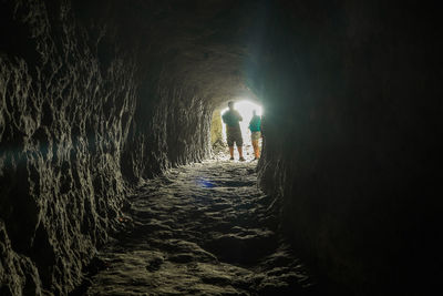 Illuminated tunnel at night