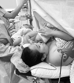 High angle view of people on bed