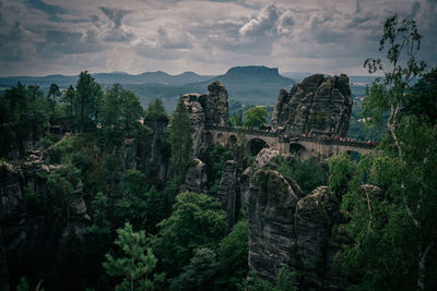 Panoramic view of bridge against cloudy sky