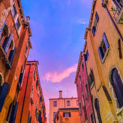 Low angle view of buildings in city against sky