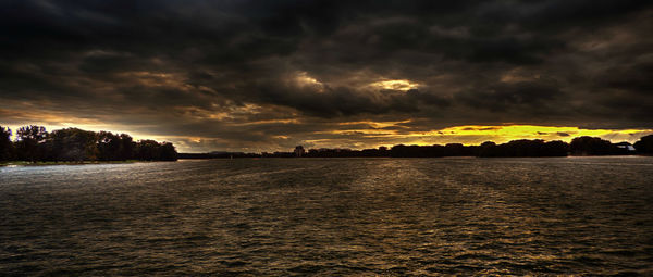 Scenic view of sea against cloudy sky