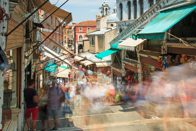 Long exposure of people in market