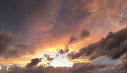 Low angle view of dramatic sky during sunset