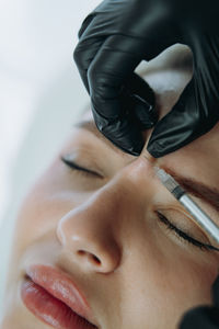 Close-up of young woman with eyes closed