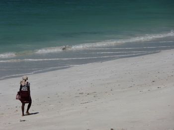 Silhouette of woman on beach