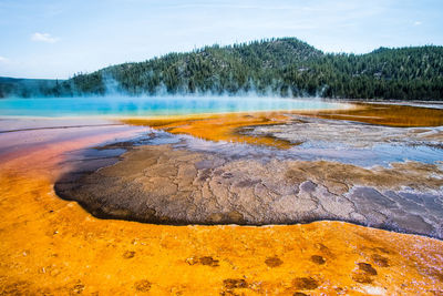 View of sun shining over water