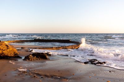 Scenic view of sea against clear sky