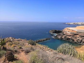 Scenic view of sea against clear blue sky