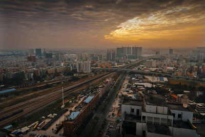 High angle view of buildings against sky during sunset