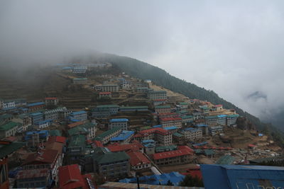 Aerial view of cityscape against sky