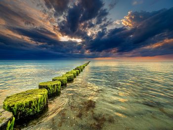 Scenic view of sea against sky during sunset