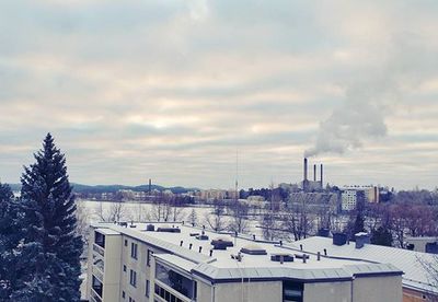 Buildings against cloudy sky