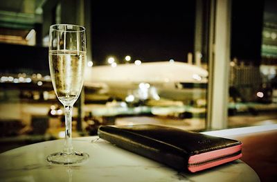 Close-up of champagne glass on table at restaurant