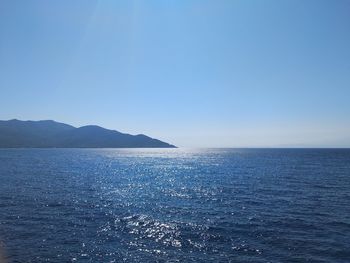 Scenic view of sea against clear blue sky