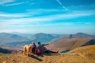 View of a dog looking at mountains