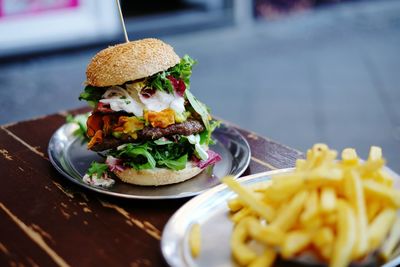 Close-up of large hamburger on table