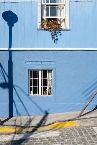 Street light by wall of building