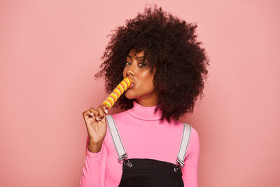 Funny woman with ice cream looking at camera