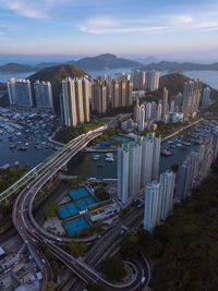 Aerial view of cityscape against sky during sunset