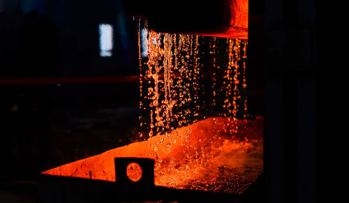 Close-up of illuminated glass of water