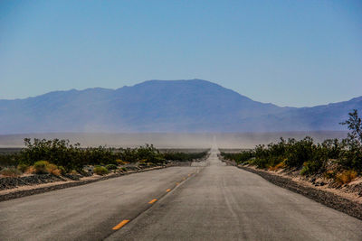 Road on mountain against sky